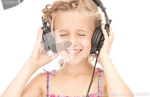 Image of happy girl in big headphones