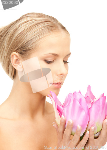 Image of beautiful woman with lotus flower
