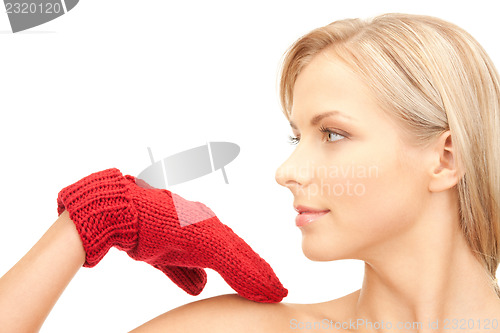 Image of beautiful woman in red mittens