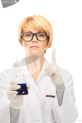 Image of lab worker holding up test tube