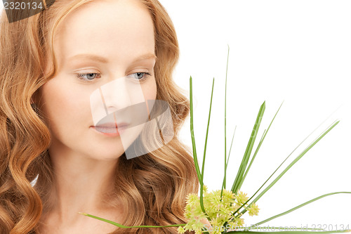 Image of woman with green sprout