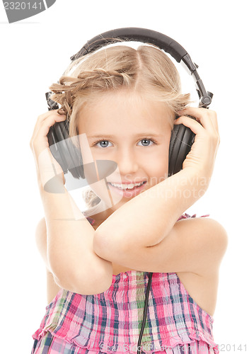 Image of happy girl in big headphones