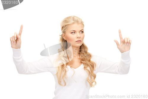 Image of businesswoman working with something imaginary