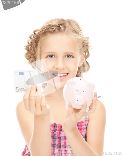 Image of little girl with piggy bank and money