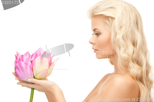 Image of beautiful woman with lotus flower
