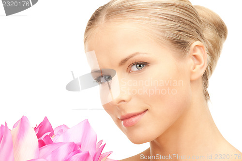 Image of beautiful woman with lotus flower