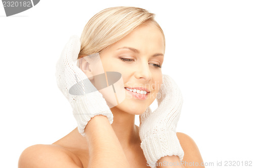 Image of beautiful woman in white mittens