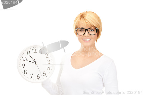 Image of woman holding big clock