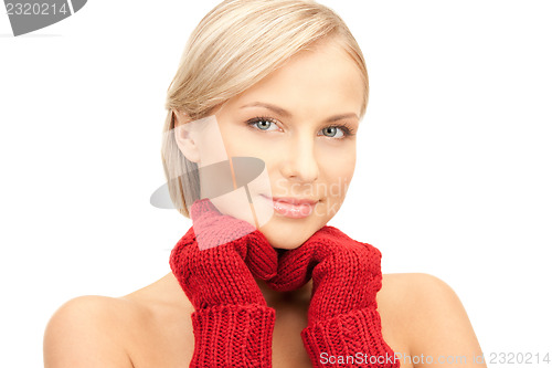 Image of beautiful woman in red mittens