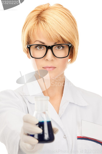 Image of lab worker holding up test tube