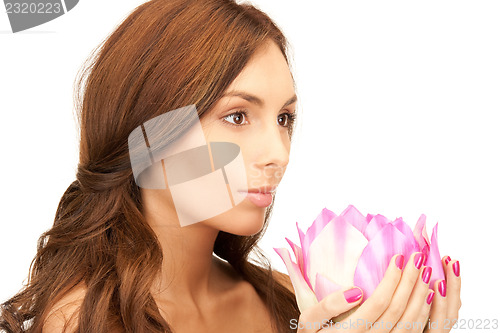 Image of beautiful woman with lotus flower