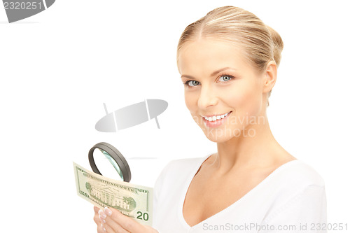 Image of woman with magnifying glass and money