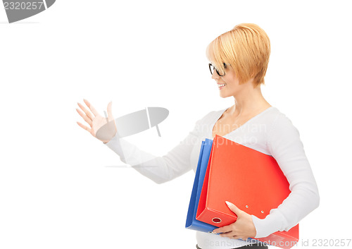 Image of businesswoman with folders ready for handshake