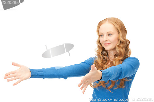 Image of businesswoman working with something imaginary