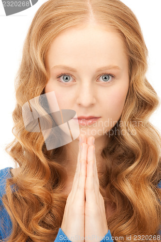 Image of praying businesswoman