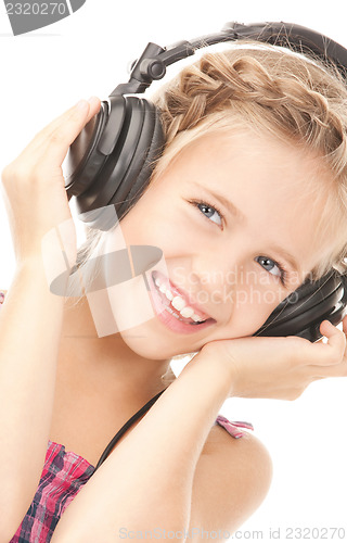 Image of happy girl in big headphones