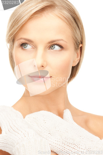 Image of beautiful woman in white mittens