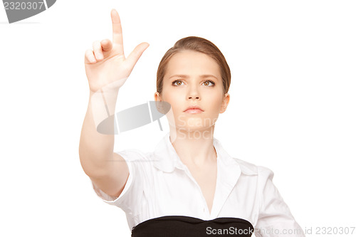 Image of businesswoman working with something imaginary