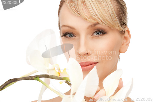 Image of beautiful woman with orchid flower 