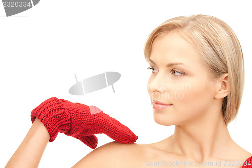 Image of beautiful woman in red mittens