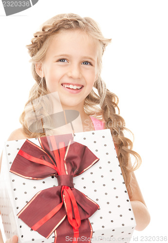 Image of happy little girl with gift box