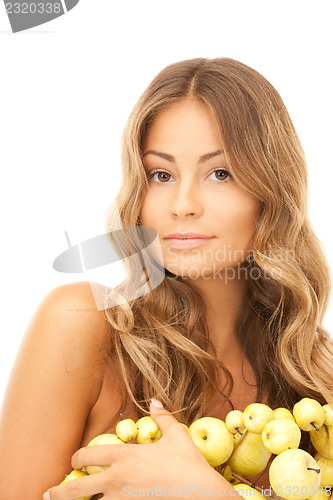 Image of lovely woman with green apples