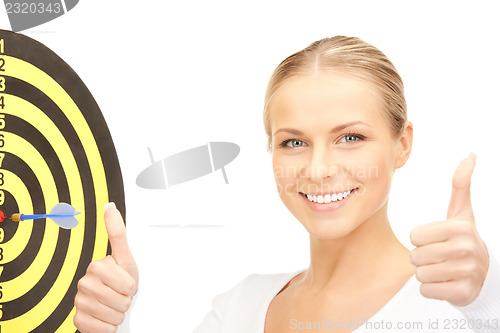 Image of businesswoman with dart and target