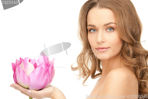 Image of beautiful woman with lotus flower