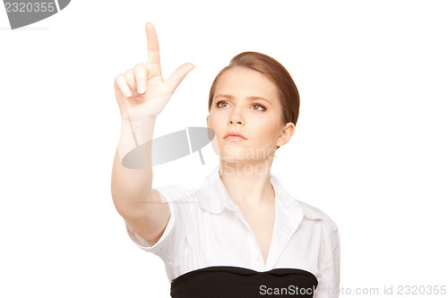 Image of businesswoman working with something imaginary