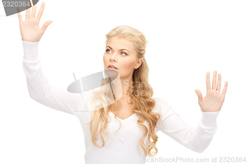 Image of businesswoman working with something imaginary