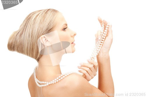 Image of beautiful woman with pearl beads