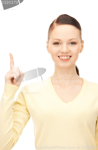 Image of  woman with her finger up	 