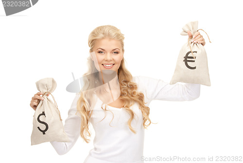 Image of woman with euro and dollar bags