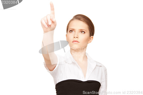 Image of businesswoman working with something imaginary