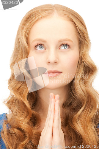 Image of praying businesswoman