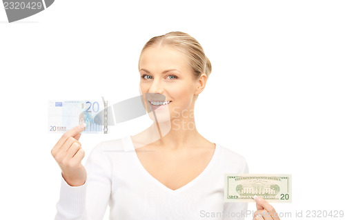 Image of woman with euro and dollar money notes