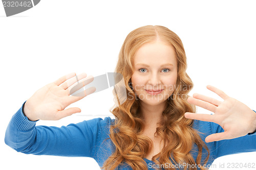 Image of businesswoman working with something imaginary