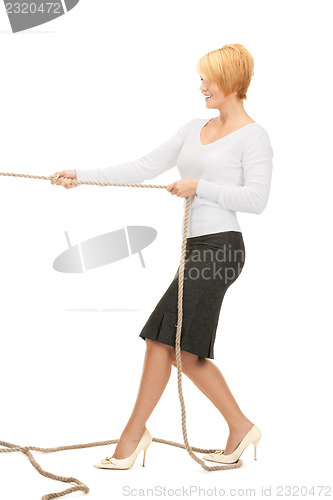 Image of business woman pulling rope