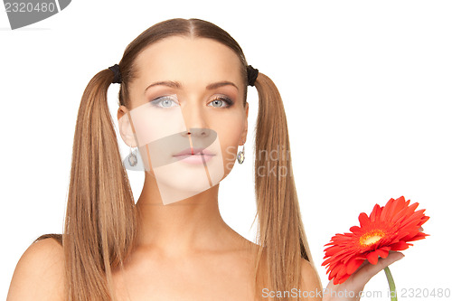 Image of lovely woman with red flower