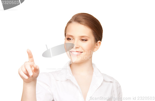 Image of businesswoman working with something imaginary
