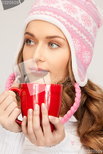 Image of beautiful woman with red mug