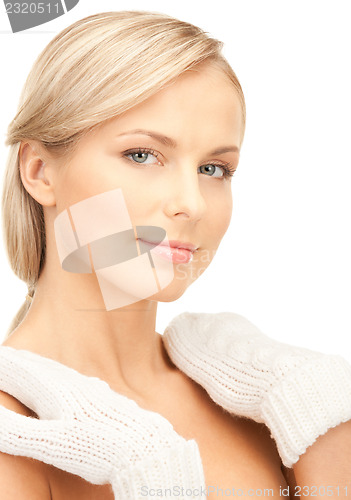 Image of beautiful woman in white mittens