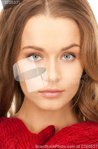 Image of beautiful woman in red mittens