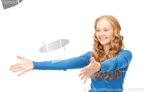 Image of businesswoman working with something imaginary