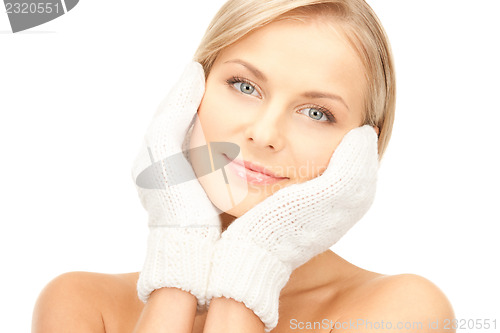 Image of beautiful woman in white mittens