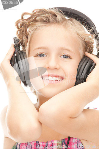 Image of happy girl in big headphones