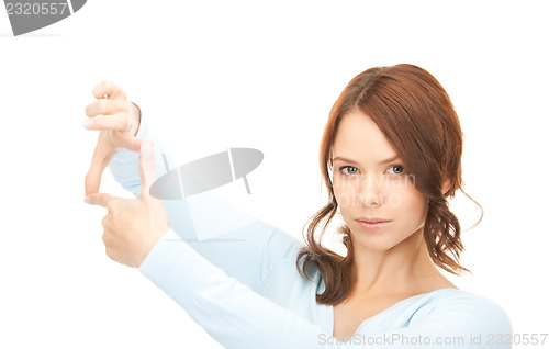 Image of lovely woman creating a frame with fingers