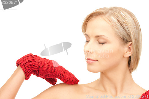 Image of beautiful woman in red mittens