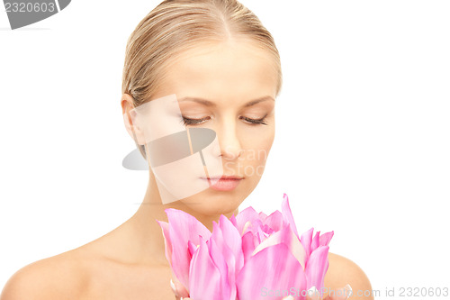 Image of beautiful woman with flower