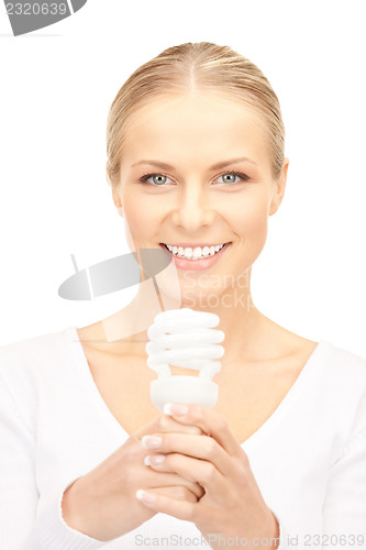 Image of woman holding energy saving bulb